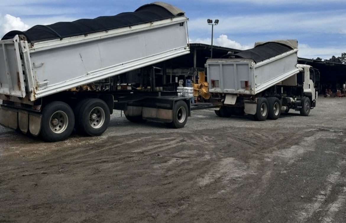 Material haulage trucks on site